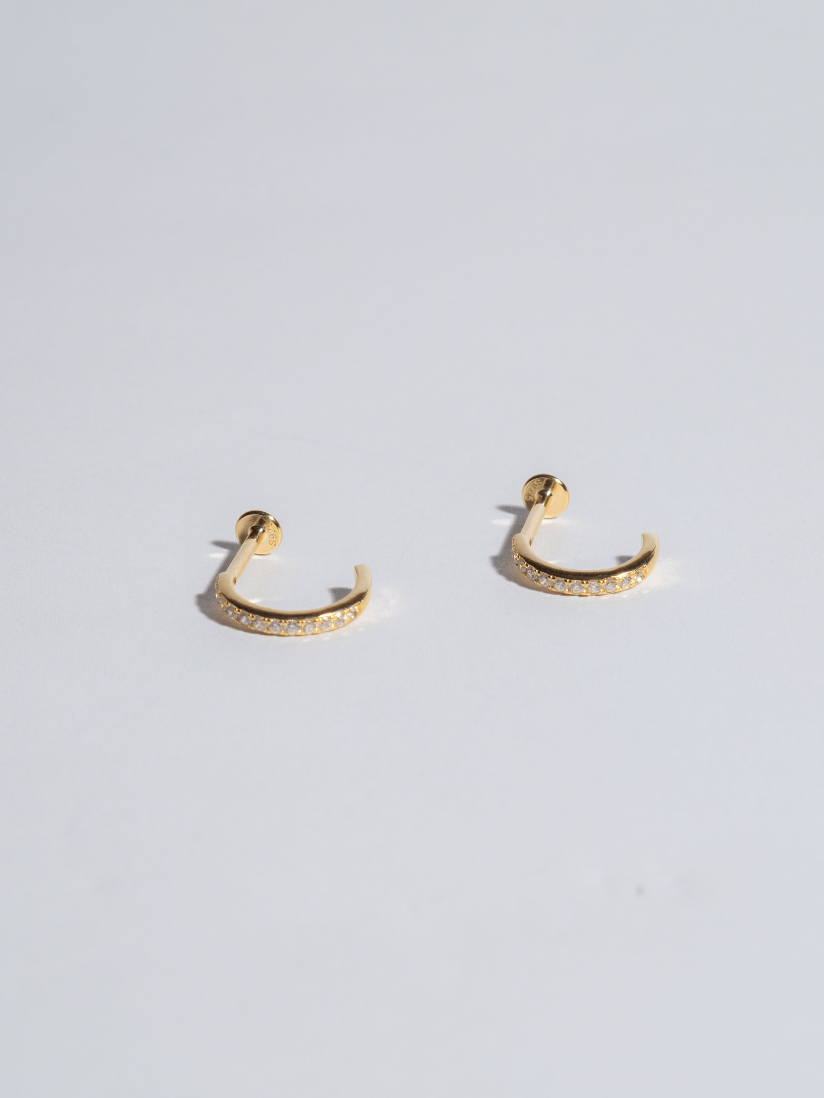 Piercing 6 black zircons